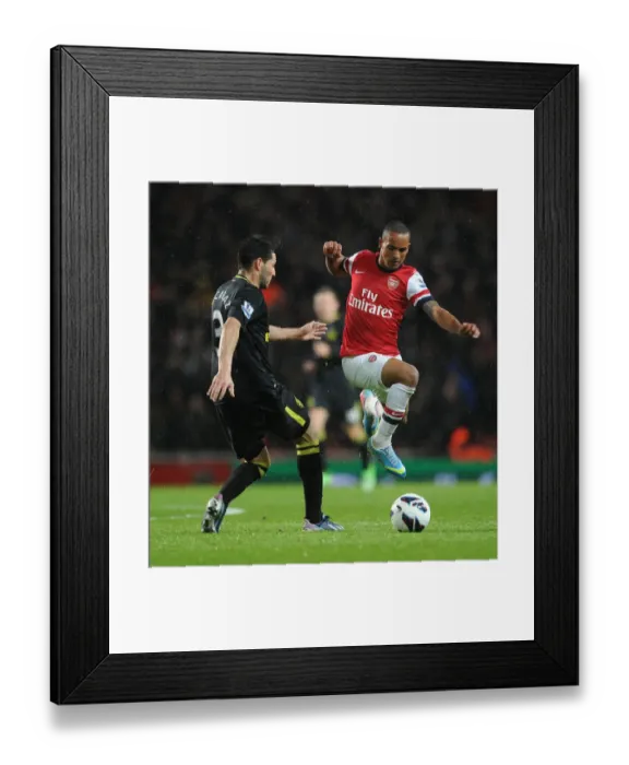 Framed Print : Theo Walcott's Brilliant Performance: Arsenal Crushes Wigan Athletic 4-1 in Premier League Framed Print : Theo Walcott's Brilliant Performance: Arsenal Crushes Wigan Athletic 4-1 in Premier League