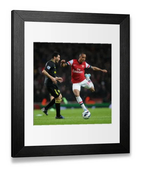 Framed Print : Theo Walcott (Arsenal) Antolin Alcaraz (Wigan). Arsenal 4: 1 Wigan Athletic. Barclays Premier League Framed Print : Theo Walcott (Arsenal) Antolin Alcaraz (Wigan). Arsenal 4: 1 Wigan Athletic. Barclays Premier League