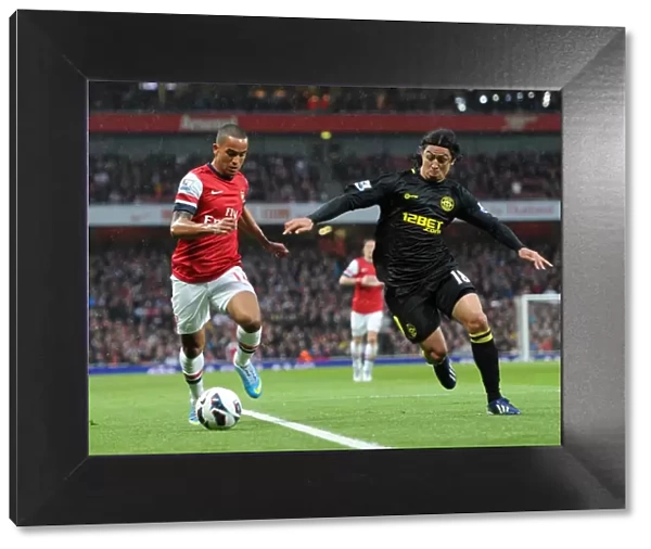 Theo Walcott (Arsenal) Roger Espinoza (Newcastle). Arsenal 4: 1 Wigan Athletic. Barclays