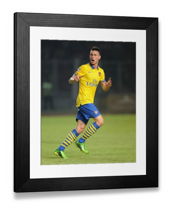 Framed Print : Arsenal's Koscielny Clashes with Indonesia All-Stars in 2013 Framed Print : Arsenal's Koscielny Clashes with Indonesia All-Stars in 2013