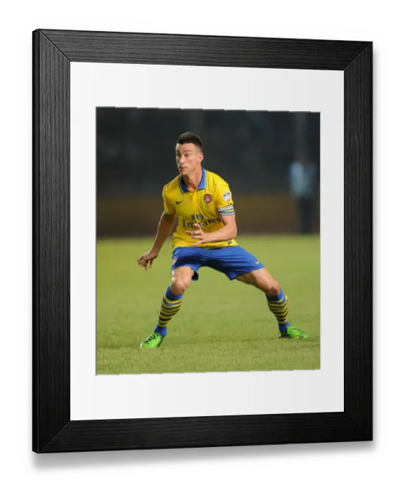 Framed Print : Arsenal's Laurent Koscielny Clashes with Indonesia All-Stars in 2013