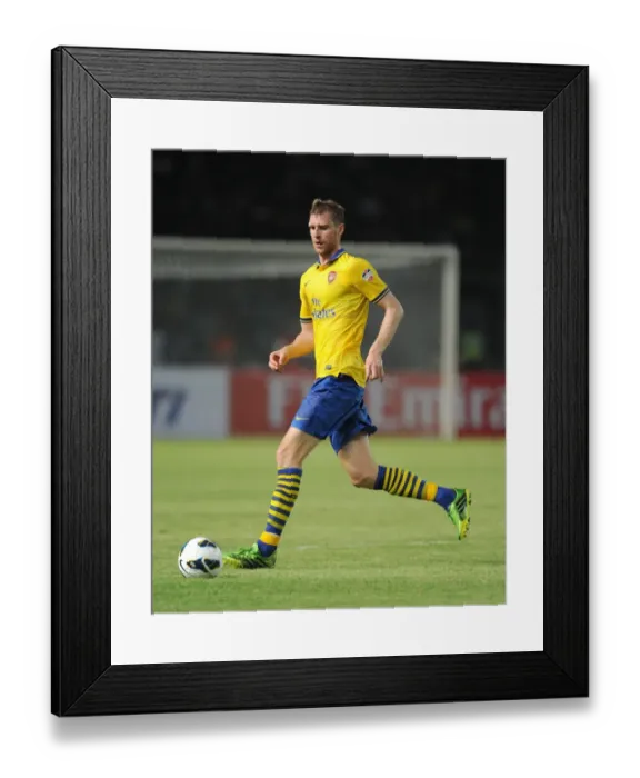 Framed Print : Per Mertesacker in Action against Indonesia All-Stars (2013)