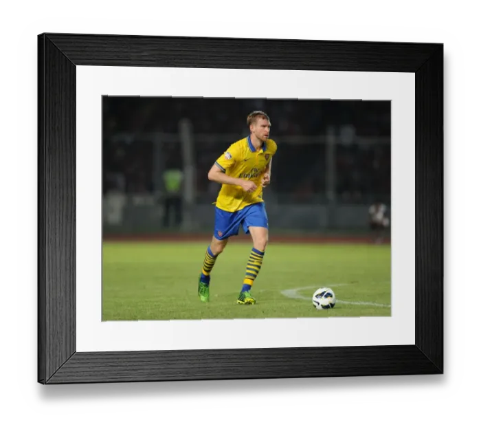 Framed Print : Per Mertesacker Leads Arsenal Against Indonesia All-Stars in 2013