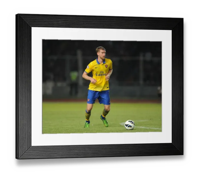 Framed Print : Per Mertesacker Leads Arsenal Against Indonesia All-Stars (2013) Framed Print : Per Mertesacker Leads Arsenal Against Indonesia All-Stars (2013)