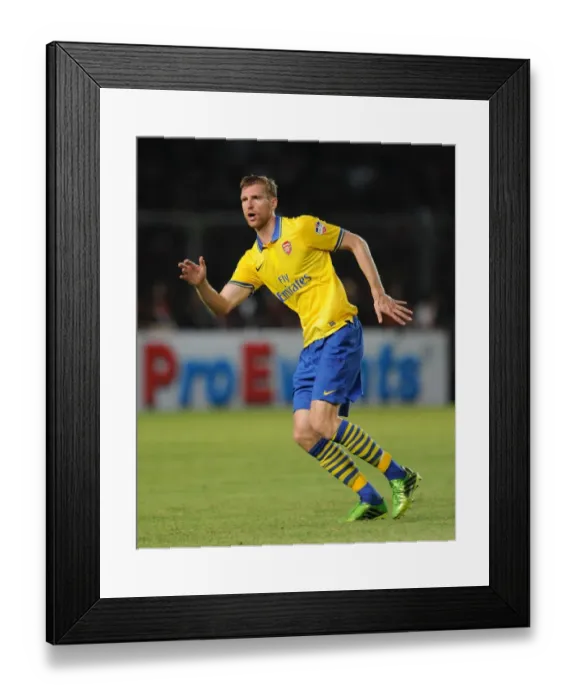 Framed Print : Per Mertesacker Faces Off Against Indonesia All-Stars in 2013