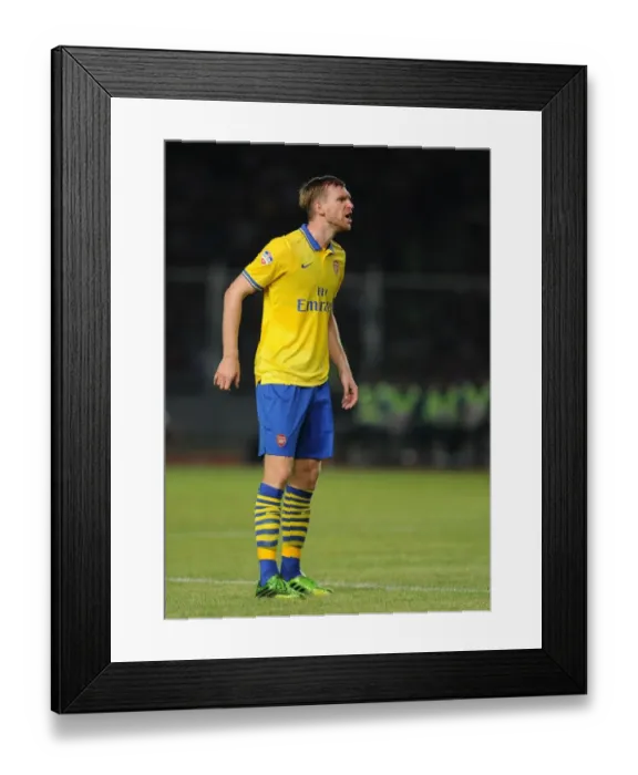 Framed Print : Per Mertesacker in Action: Arsenal vs Indonesia All-Stars, 2013