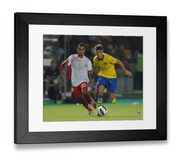 Framed Print : Arsenal vs Indonesia All-Stars: Kris Olsson vs Rizky Ripora in Action