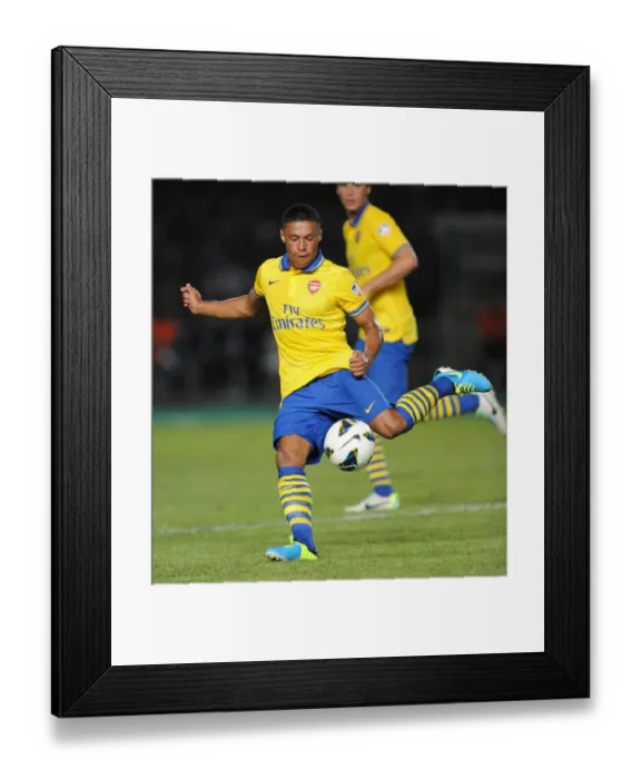 Framed Print : Alex Oxlade-Chamberlain in Action: Arsenal vs Indonesia All-Stars (2013)