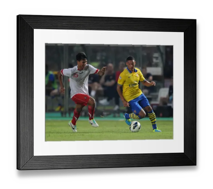 Framed Print : Alex Oxlade-Chamberlain vs. Ahmad Jufrianto: Arsenal vs. Indonesia All-Stars, 2013 Framed Print : Alex Oxlade-Chamberlain vs. Ahmad Jufrianto: Arsenal vs. Indonesia All-Stars, 2013