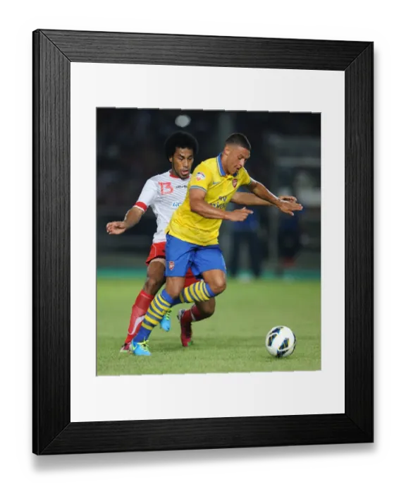 Framed Print : Alex Oxlade-Chamberlain vs. Ian Kabes: Arsenal vs. Indonesia All-Stars, 2013 Framed Print : Alex Oxlade-Chamberlain vs. Ian Kabes: Arsenal vs. Indonesia All-Stars, 2013