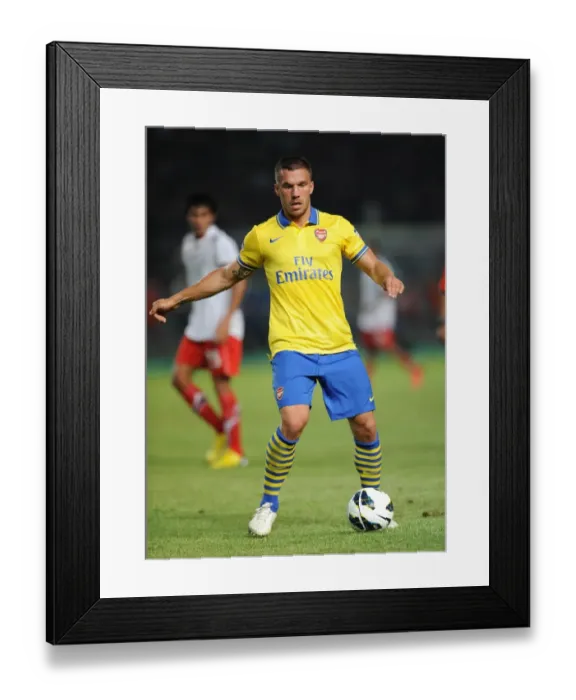 Framed Print : Lukas Podolski Shines in Arsenal's Victory against Indonesia All-Stars, 2013