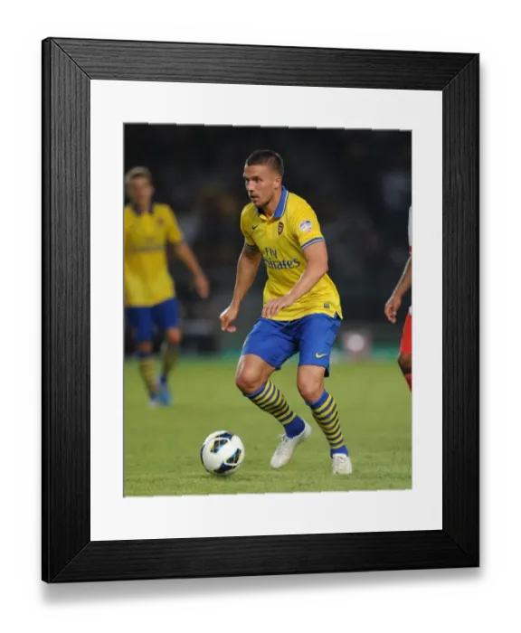 Framed Print : Lukas Podolski Faces Off Against Indonesia All-Stars in 2013-14 Framed Print : Lukas Podolski Faces Off Against Indonesia All-Stars in 2013-14
