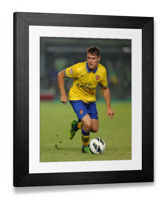 Framed Print : Aaron Ramsey Faces Off Against Indonesia All-Stars in 2013