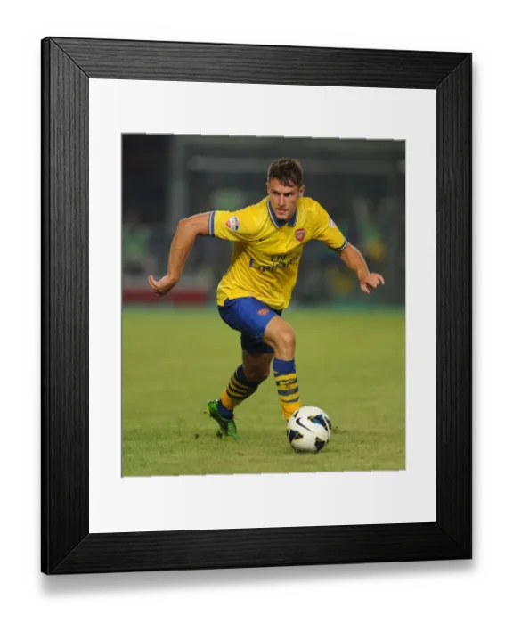 Framed Print : Aaron Ramsey Faces Off Against Indonesia All-Stars in 2013 Jakarta Showdown