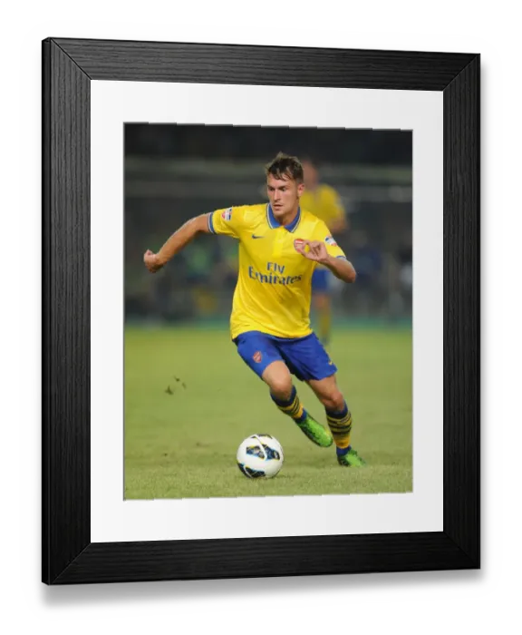 Framed Print : Aaron Ramsey Faces Off Against Indonesia All-Stars in 2013: Arsenal Star's Thrilling Showdown Framed Print : Aaron Ramsey Faces Off Against Indonesia All-Stars in 2013: Arsenal Star's Thrilling Showdown