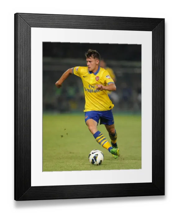 Framed Print : Arsenal's Aaron Ramsey Clashes with Indonesia All-Stars in 2013 Jakarta Showdown Framed Print : Arsenal's Aaron Ramsey Clashes with Indonesia All-Stars in 2013 Jakarta Showdown