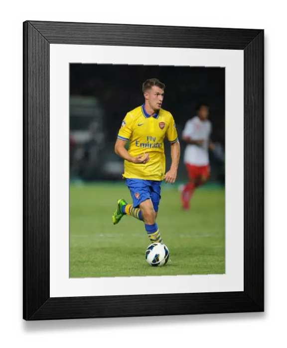 Framed Print : Arsenal's Aaron Ramsey Faces Off Against Indonesia All-Stars in 2013