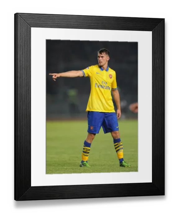 Framed Print : Arsenal's Aaron Ramsey Goes Head-to-Head with Indonesia All-Stars in 2013 Showdown Framed Print : Arsenal's Aaron Ramsey Goes Head-to-Head with Indonesia All-Stars in 2013 Showdown