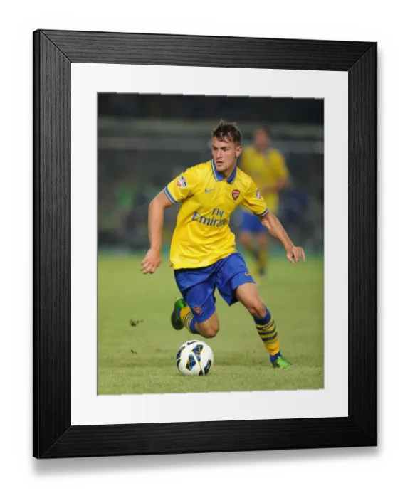 Framed Print : Aaron Ramsey Faces Off Against Indonesia All-Stars in 2013 Friendly Match