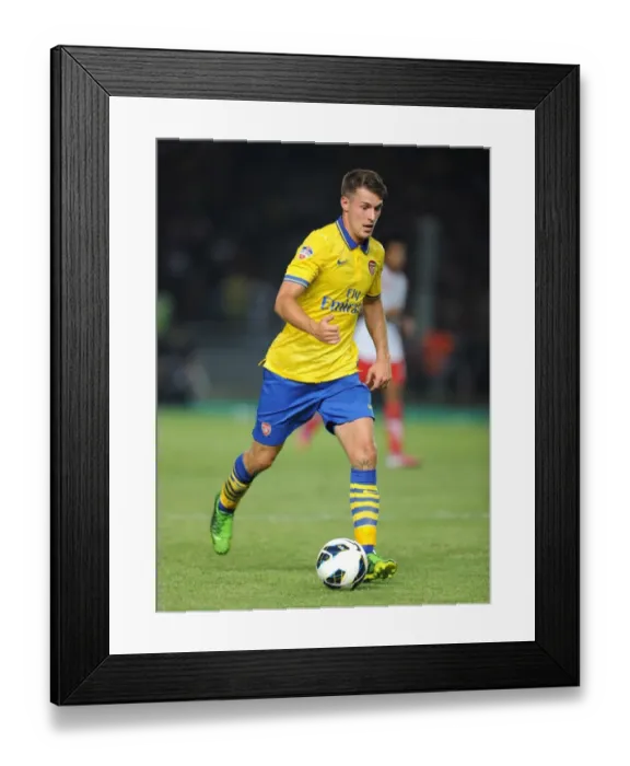 Framed Print : Arsenal's Aaron Ramsey Takes on Indonesia All-Stars in 2013 Showdown Framed Print : Arsenal's Aaron Ramsey Takes on Indonesia All-Stars in 2013 Showdown
