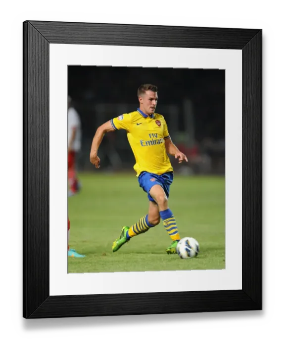 Framed Print : Aaron Ramsey Faces Off Against Indonesia All-Stars in 2013 Friendly Match