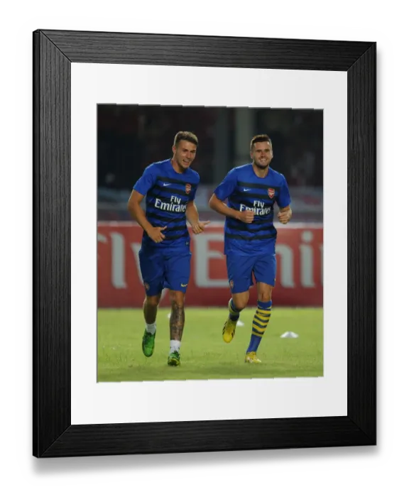 Framed Print : Arsenal Players Aaron Ramsey and Carl Jenkinson Warm Up Ahead of Indonesia All-Stars Match Framed Print : Arsenal Players Aaron Ramsey and Carl Jenkinson Warm Up Ahead of Indonesia All-Stars Match