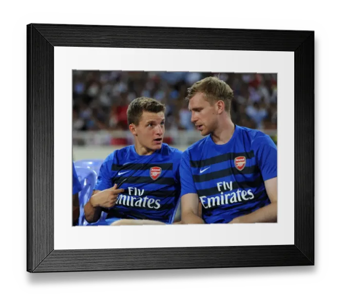 Framed Print : Arsenal Stars Thomas Eisfeld and Per Mertesacker Engage in Pre-Match Chat during Vietnam Friendly, 2013