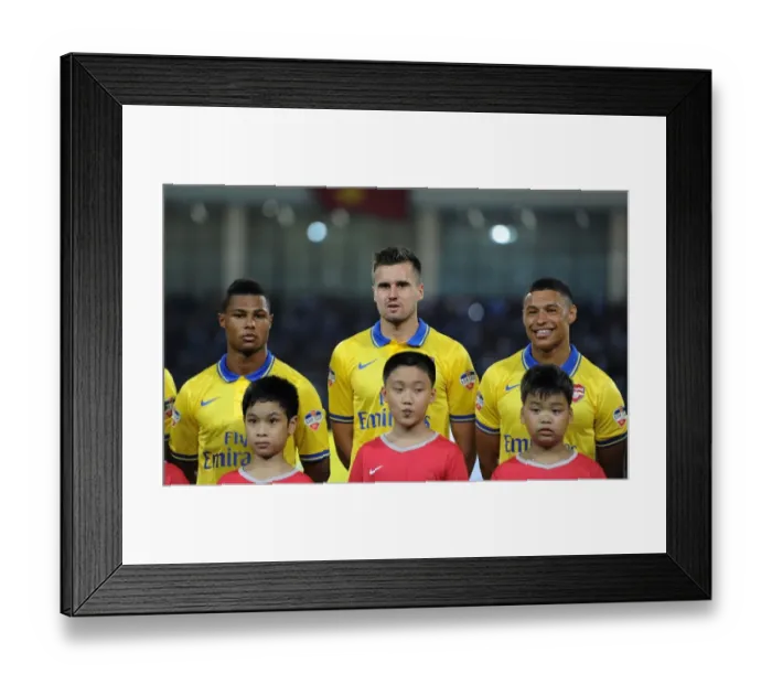 Framed Print : Arsenal FC: Jenkinson, Gnabry, Oxlade-Chamberlain Line Up Against Vietnam (2013) Framed Print : Arsenal FC: Jenkinson, Gnabry, Oxlade-Chamberlain Line Up Against Vietnam (2013)
