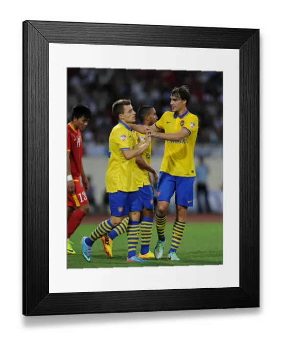 Framed Print : Ignasi Miquel and Thomas Eisfeld Celebrate Goal for Arsenal against Vietnam (2013)