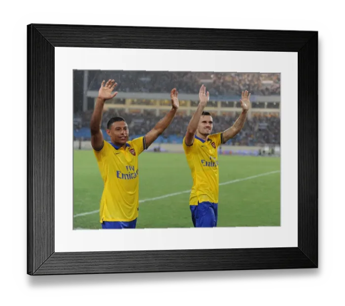 Framed Print : Arsenal Players Alex Oxlade-Chamberlain and Carl Jenkinson Wave to Fans after Vietnam Friendly Match