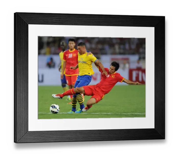 Framed Print : Alex Oxlade-Chamberlain vs Pham Nguyen Sa: Vietnam vs Arsenal Clash, 2013 Framed Print : Alex Oxlade-Chamberlain vs Pham Nguyen Sa: Vietnam vs Arsenal Clash, 2013
