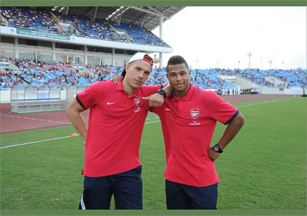HANOI, VIETNAM - JULY 17: Lukas Podolski and Serge Gnabry of Arsenal before the international