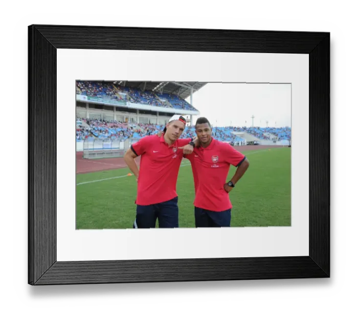 Framed Print : HANOI, VIETNAM - JULY 17: Lukas Podolski and Serge Gnabry of Arsenal before the international Framed Print : HANOI, VIETNAM - JULY 17: Lukas Podolski and Serge Gnabry of Arsenal before the international