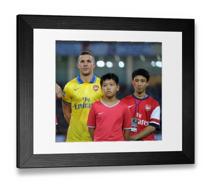 Framed Print : Lukas Podolski's Vietnam Adventure: The Running Man with Arsenal Framed Print : Lukas Podolski's Vietnam Adventure: The Running Man with Arsenal