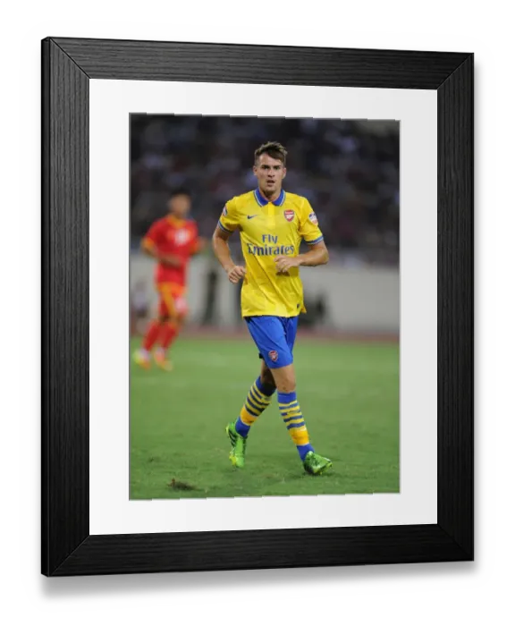 Framed Print : Aaron Ramsey in Action: Vietnam vs. Arsenal (2013-14) Framed Print : Aaron Ramsey in Action: Vietnam vs. Arsenal (2013-14)