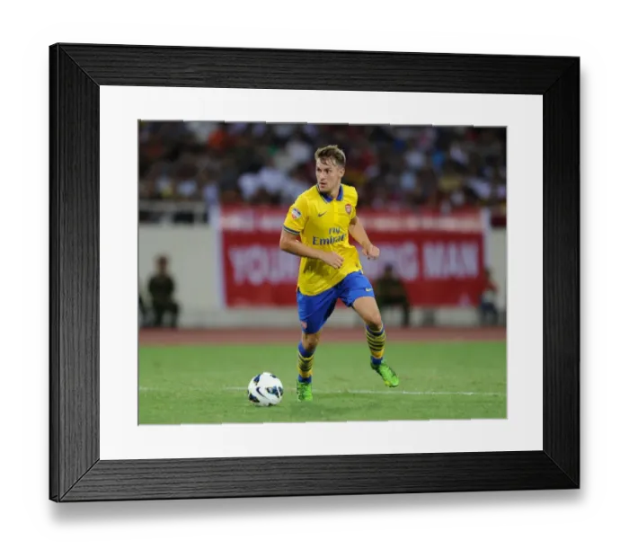 Framed Print : Aaron Ramsey: In Action Against Vietnam (2013-14) Framed Print : Aaron Ramsey: In Action Against Vietnam (2013-14)