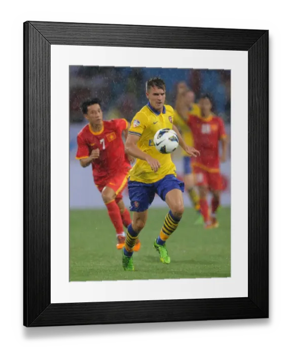 Framed Print : Aaron Ramsey in Action: Vietnam vs. Arsenal (2013-14) Framed Print : Aaron Ramsey in Action: Vietnam vs. Arsenal (2013-14)