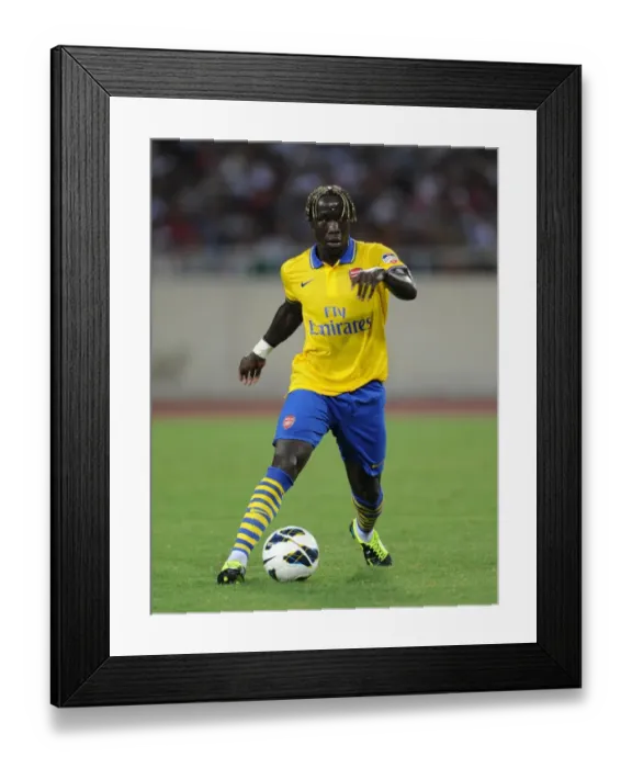 Framed Print : Bacary Sagna in Action: Vietnam vs. Arsenal (2013-14) Framed Print : Bacary Sagna in Action: Vietnam vs. Arsenal (2013-14)