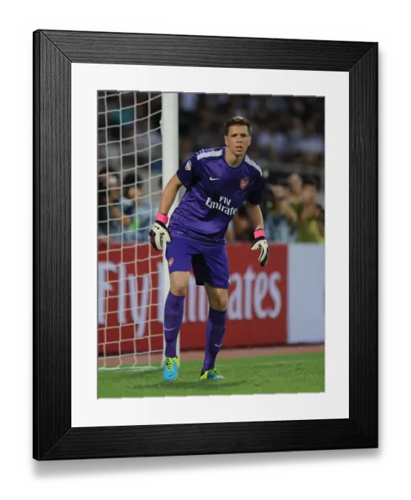 Framed Print : Wojciech Szczesny in Action: Vietnam vs. Arsenal (2013-14) Framed Print : Wojciech Szczesny in Action: Vietnam vs. Arsenal (2013-14)