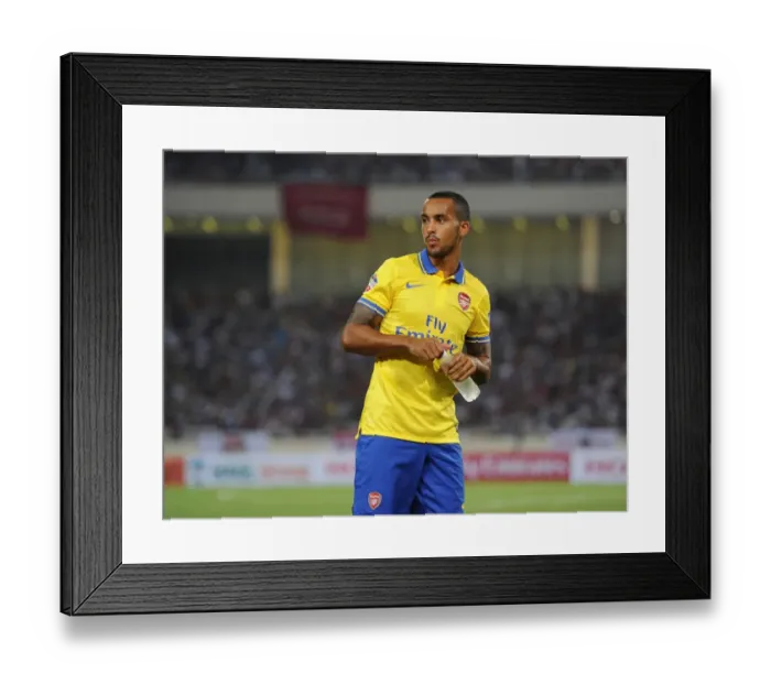 Framed Print : Theo Walcott Awaits Substitution: Vietnam vs. Arsenal (2013)
