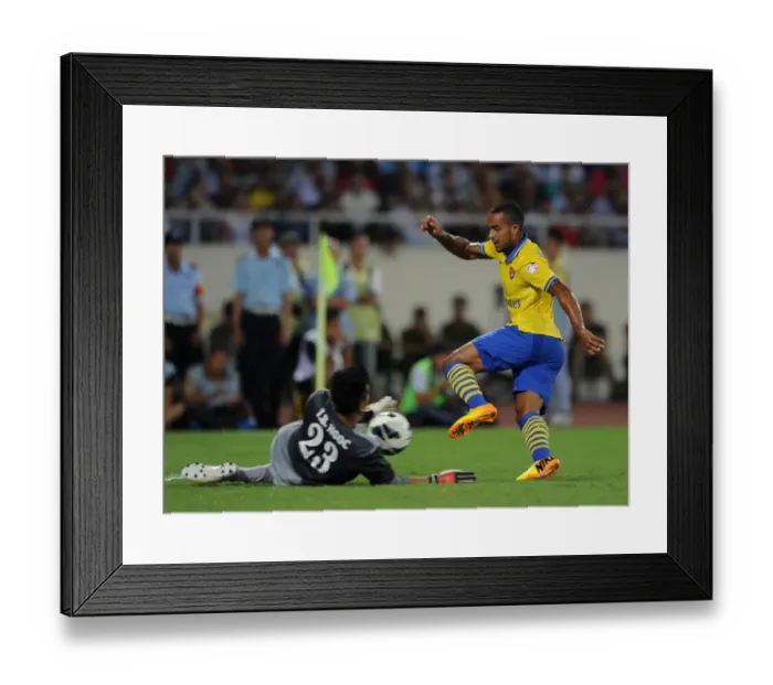 Framed Print : Theo Walcott vs Tran Buu Ngoc: Vietnam Stands Strong Against Arsenal