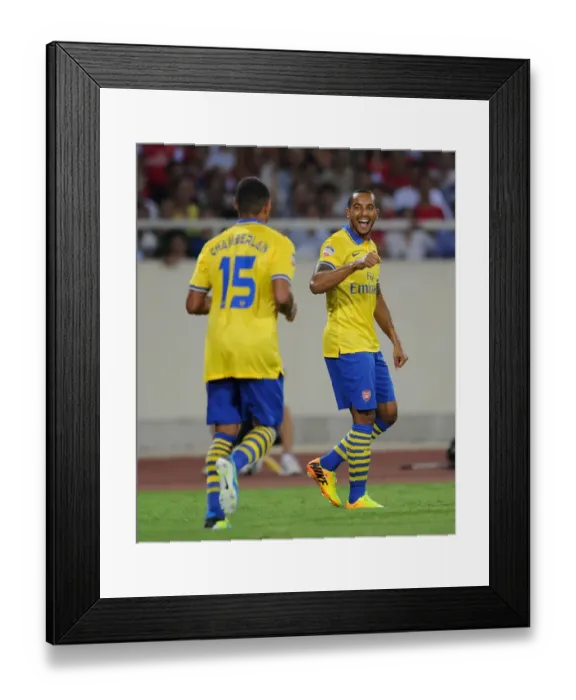 Framed Print : Arsenal Stars: Oxlade-Chamberlain Scores, Walcott Celebrates in Vietnam Friendly, 2013