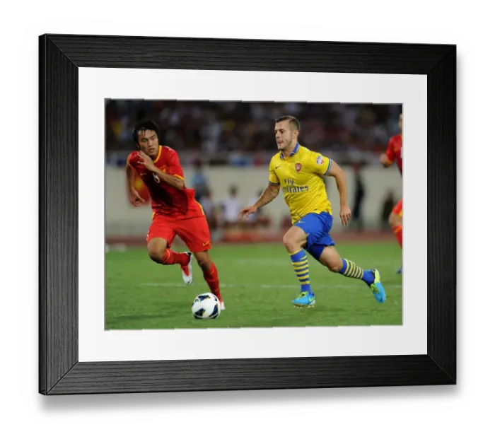 Framed Print : Jack Wilshere Overpowers Pham Nguyen Sa: Vietnam vs Arsenal, 2013