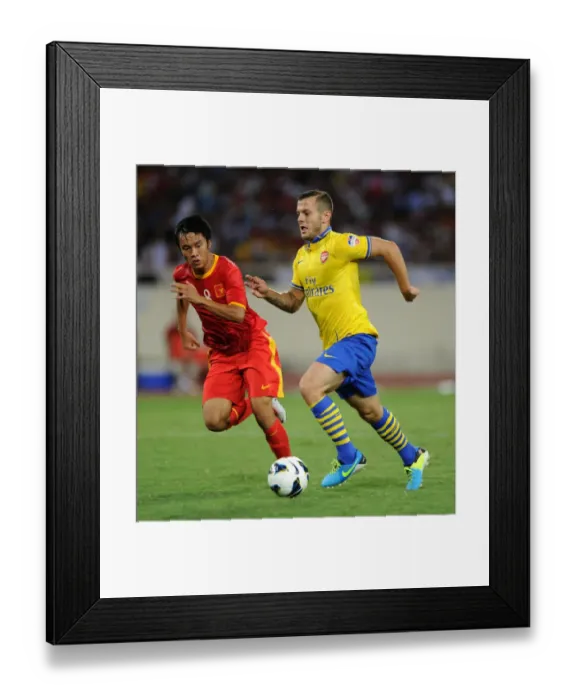 Framed Print : Jack Wilshere vs Pham Nguyen Sa: Vietnam vs Arsenal, 2013 Framed Print : Jack Wilshere vs Pham Nguyen Sa: Vietnam vs Arsenal, 2013