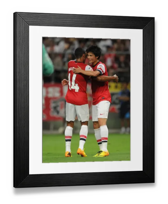 Framed Print : Arsenal's Miyaichi and Walcott Celebrate Goal in Nagoya Grampus Match, 2013