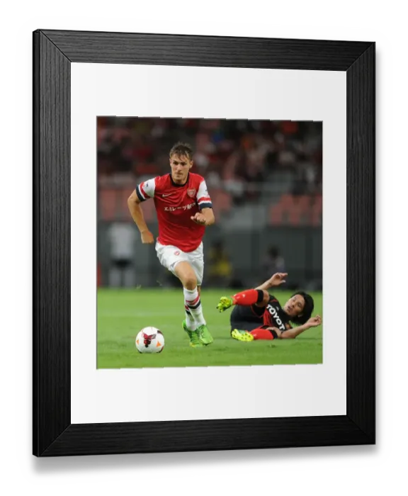 Framed Print : Arsenal's Aaron Ramsey Outsmarts Jungo Fujimoto: Pre-Season Victory over Nagoya Grampus (July 2013) Framed Print : Arsenal's Aaron Ramsey Outsmarts Jungo Fujimoto: Pre-Season Victory over Nagoya Grampus (July 2013)