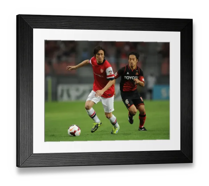 Framed Print : Arsenal's Tomas Rosicky Outruns Nagoya Grampus's Shohei Abe during 2013 Pre-Season Match