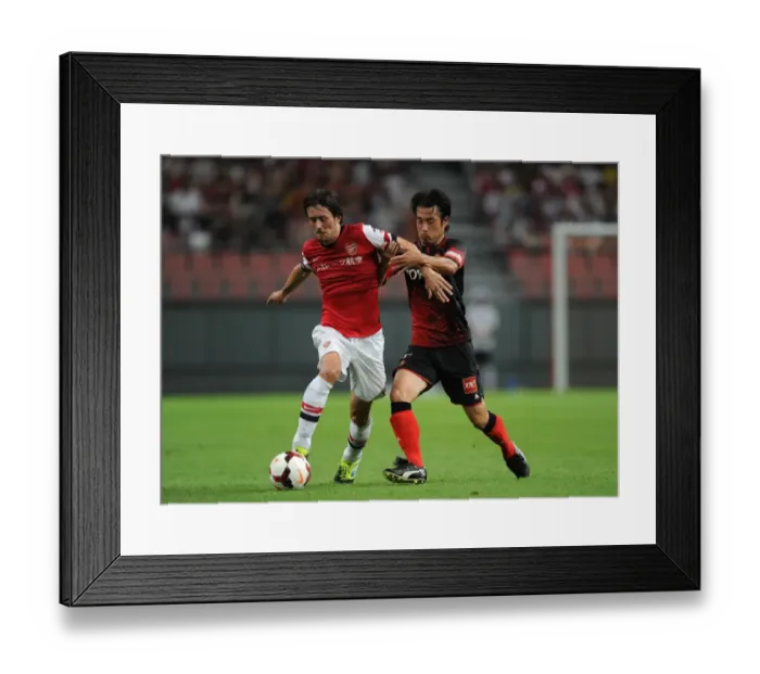 Framed Print : Arsenal's Rosicky Fouled by Nakamura in Nagoya Grampus Clash (2013) Framed Print : Arsenal's Rosicky Fouled by Nakamura in Nagoya Grampus Clash (2013)