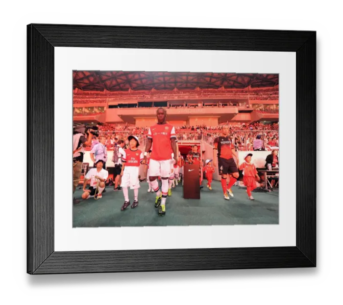 Framed Print : Bacary Sagna and Arsenal Mascot Prepare for Nagoya Grampus Match, 2013