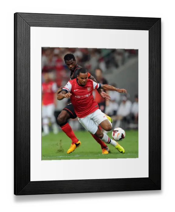 Framed Print : Theo Walcott vs Danilson: Clash in the 2013-14 Nagoya Grampus vs Arsenal Match Framed Print : Theo Walcott vs Danilson: Clash in the 2013-14 Nagoya Grampus vs Arsenal Match